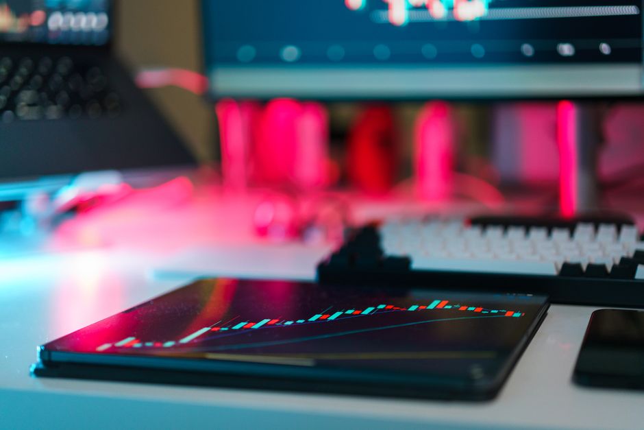 A professional trader's desk showing a sophisticated automated trading software dashboard, complete with real-time analytics and portfolio management indicators. A professional trader's desk showing a sophisticated automated trading software dashboard, complete with real-time analytics and portfolio management indicators.