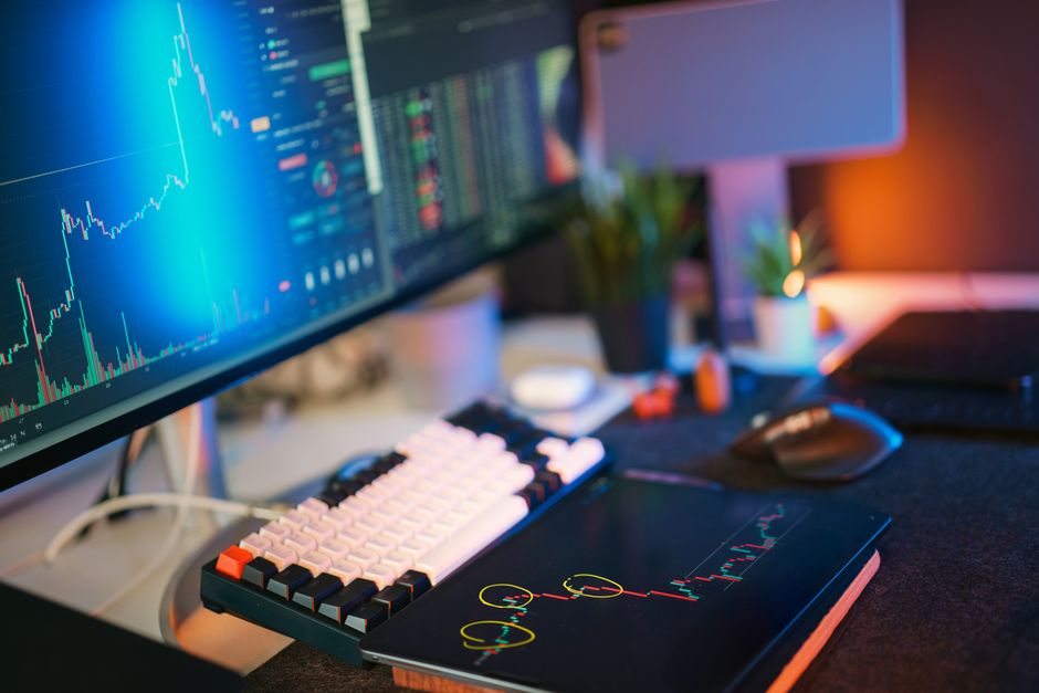 A professional investor looking at a watchlist of altcoins on their computer, with analytical graphs showing potential high-growth assets. A professional investor looking at a watchlist of altcoins on their computer, with analytical graphs showing potential high-growth assets.