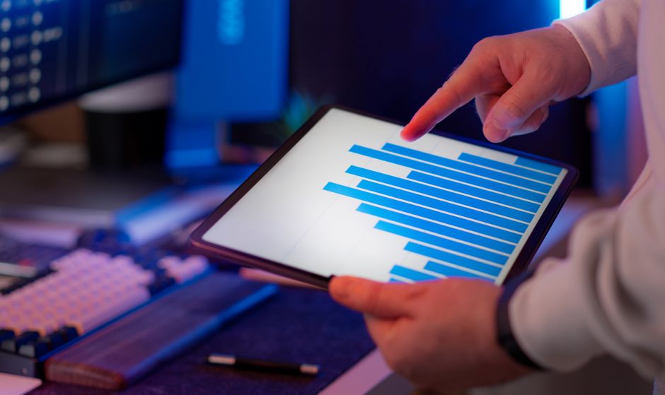 A professional investor carefully reviewing a tablet display filled with diverse cryptocurrency performance metrics and recent, high-impact news headlines. A professional investor carefully reviewing a tablet display filled with diverse cryptocurrency performance metrics and recent, high-impact news headlines.
