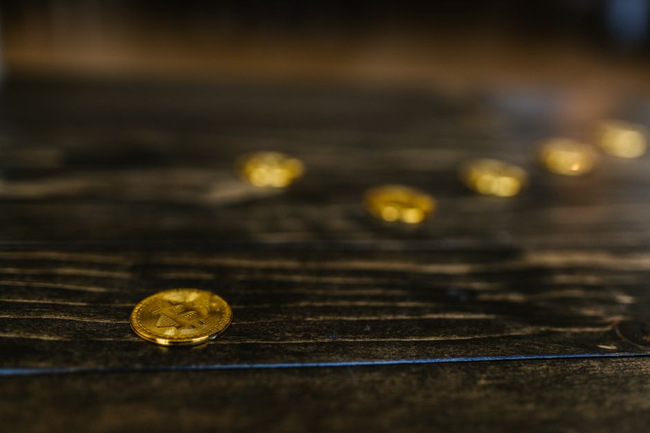 A conceptual image showing a digital shield protecting a mountain of gold bitcoin icons from lightning bolts. A conceptual image showing a digital shield protecting a mountain of gold bitcoin icons from lightning bolts.