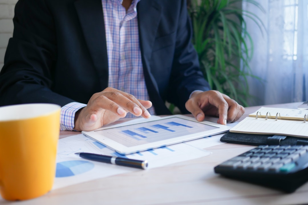 A professional financial strategy report being reviewed by an expert advisor, highlighting charts and growth projections. A professional financial strategy report being reviewed by an expert advisor, highlighting charts and growth projections.