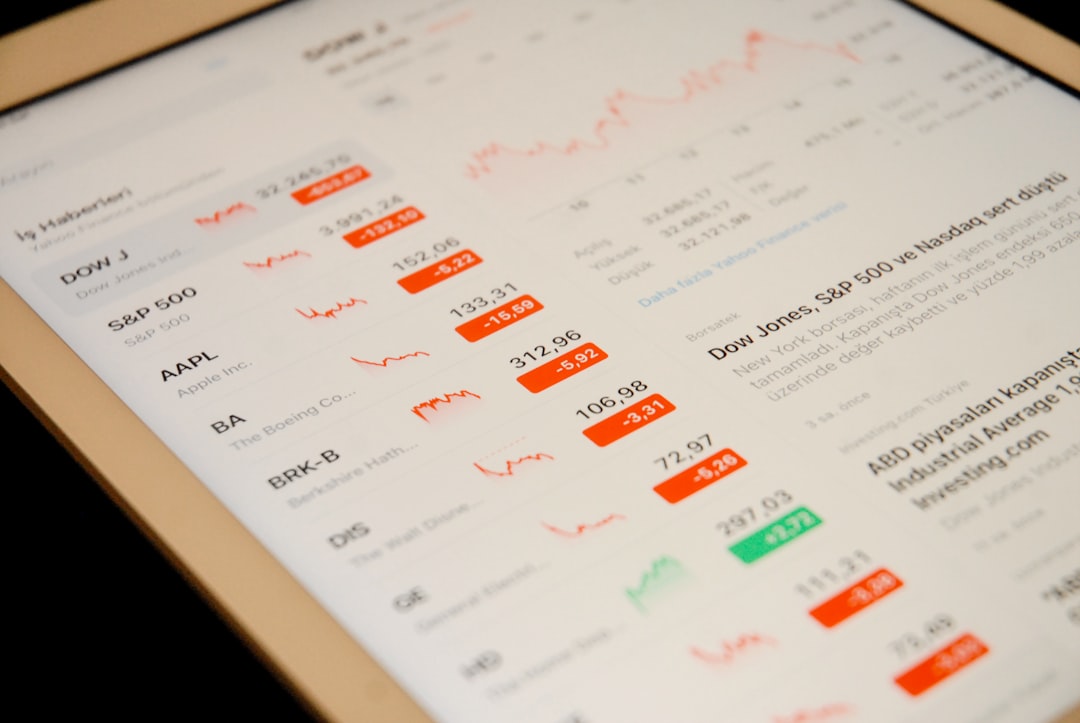 Close-up of a digital tablet showing a dividend payout calendar with growth bars highlighting multiple revenue streams. Close-up of a digital tablet showing a dividend payout calendar with growth bars highlighting multiple revenue streams.
