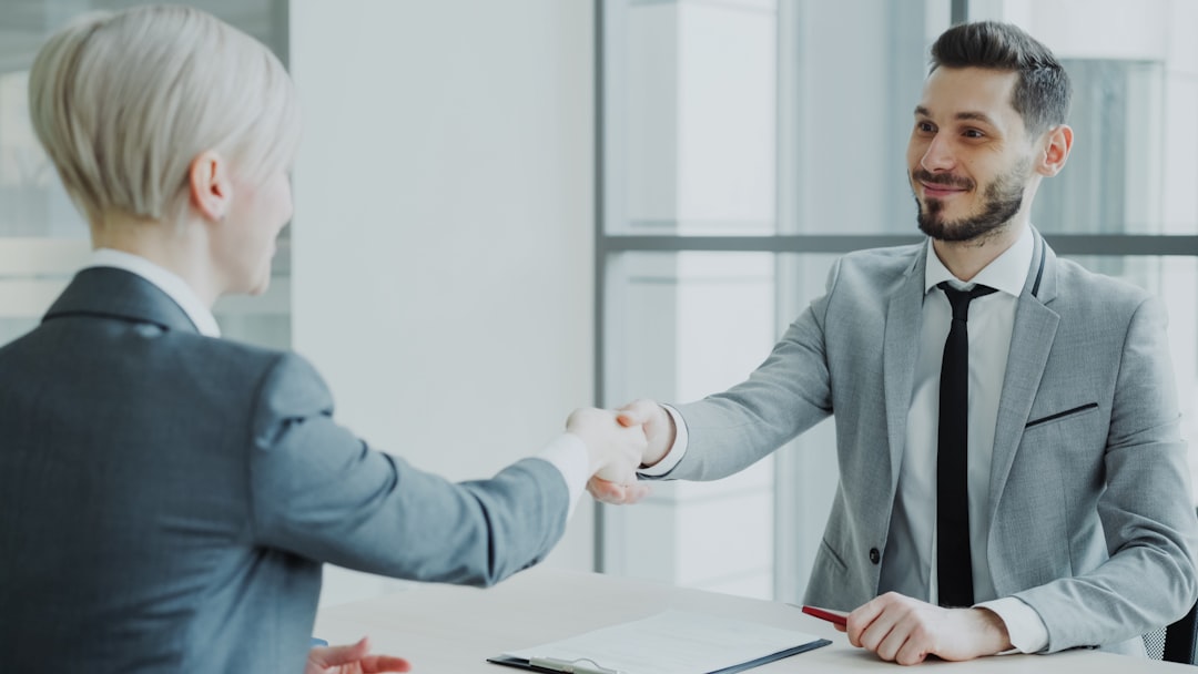 A professional handshake between two people in a modern office space, symbolizing a successful partnership. A professional handshake between two people in a modern office space, symbolizing a successful partnership.
