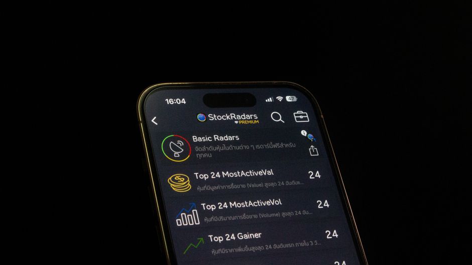 Close up of a smartphone application interface showcasing a user profile and recent trading activity summary screen. Close up of a smartphone application interface showcasing a user profile and recent trading activity summary screen.