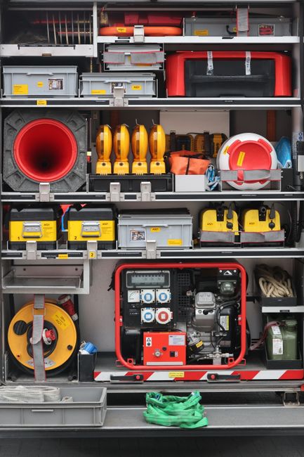 Step-by-step safety plan on a tablet beside emergency contacts and authentication hardware Step-by-step safety plan on a tablet beside emergency contacts and authentication hardware