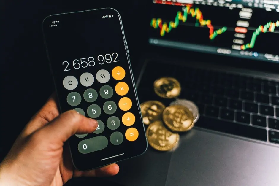 Smartphone displaying a Bitcoin mining dashboard beside ASIC miners in a professional data center Smartphone displaying a Bitcoin mining dashboard beside ASIC miners in a professional data center